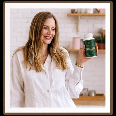 Valiora customer with the bottle in her kitchen